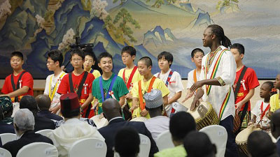 Latyr Sy plays an African drum (djembe) in Commemorative banquet hosted by Prime Minister Abe